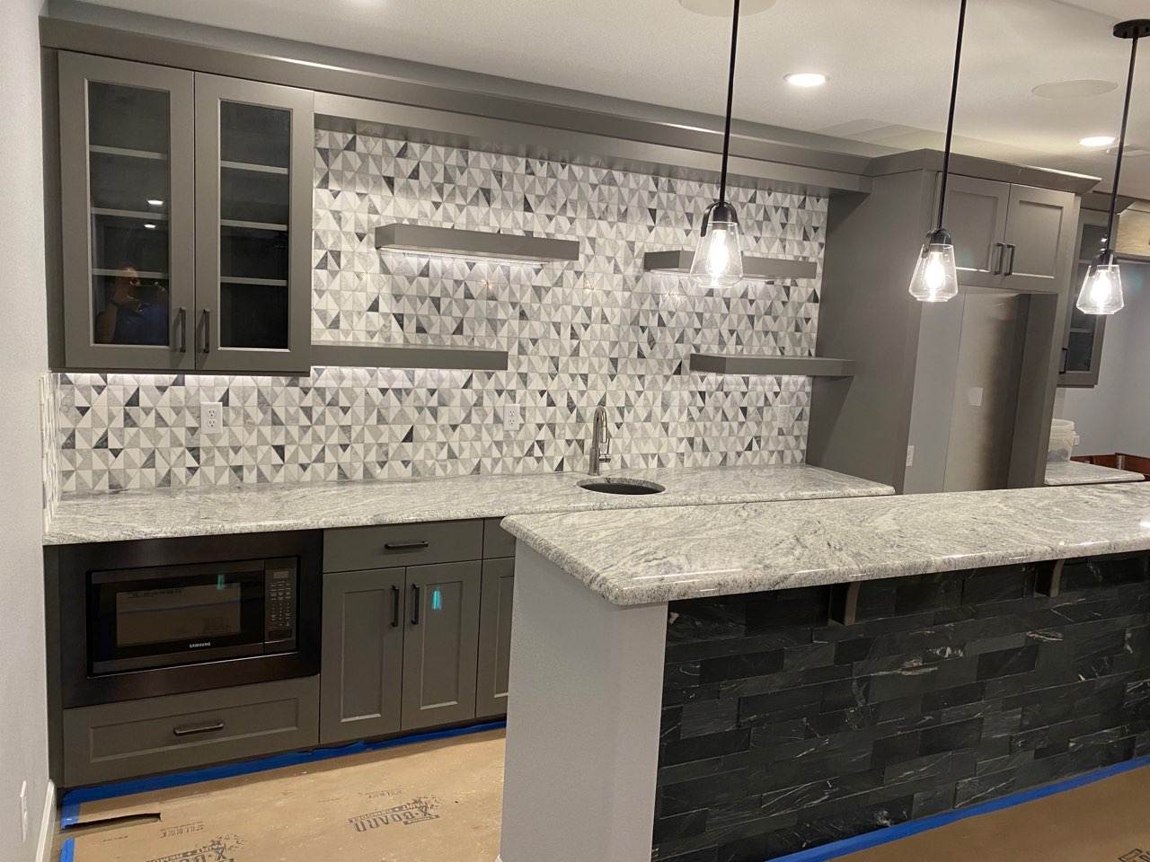custom kitchen remodel Loveland CO with tile backsplash and modern finishes